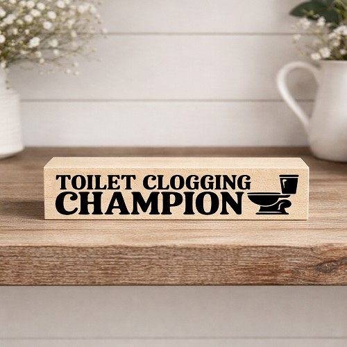 Funny bathroom sign with toilet graphic and Toilet Clogging Champion phrase 