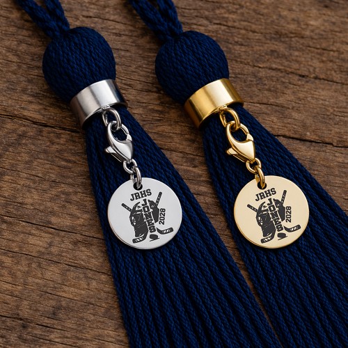 Personalized hockey graduation tassel charms in silver and gold with goalie gear, hockey sticks, player name, school initials and graduation year 