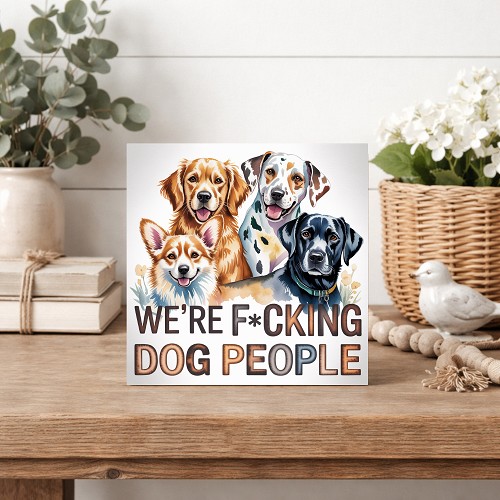 Funny Were Fcking Dog People sign featuring a colorful illustrated group of four happy dogs for dog lovers and pet parents 