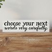 Choose your next words very carefully funny sarcastic sign with black typography and script lettering 