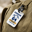Personalized football bag tag with player name, jersey number, team name, graduation year and black attachment strap 