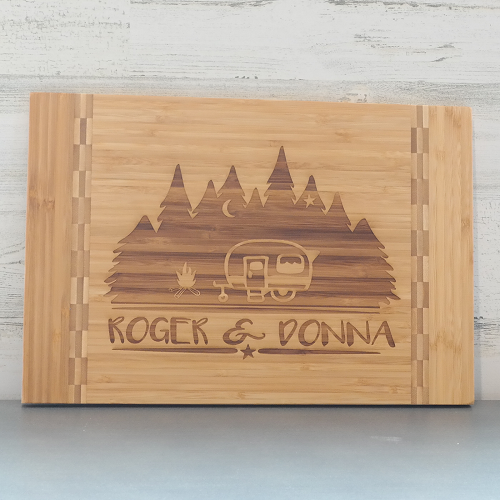 Personalized camper cutting board with pine trees campfire and custom names for camping couple gift 