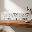 Funny Pee on the Seat Urine Trouble bathroom sign with floral accent and humorous toilet saying 